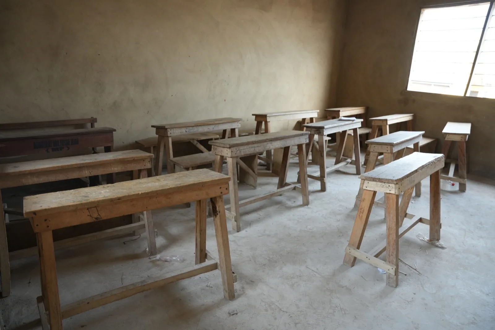 A renovated classroom with newly cemented walls and floors.